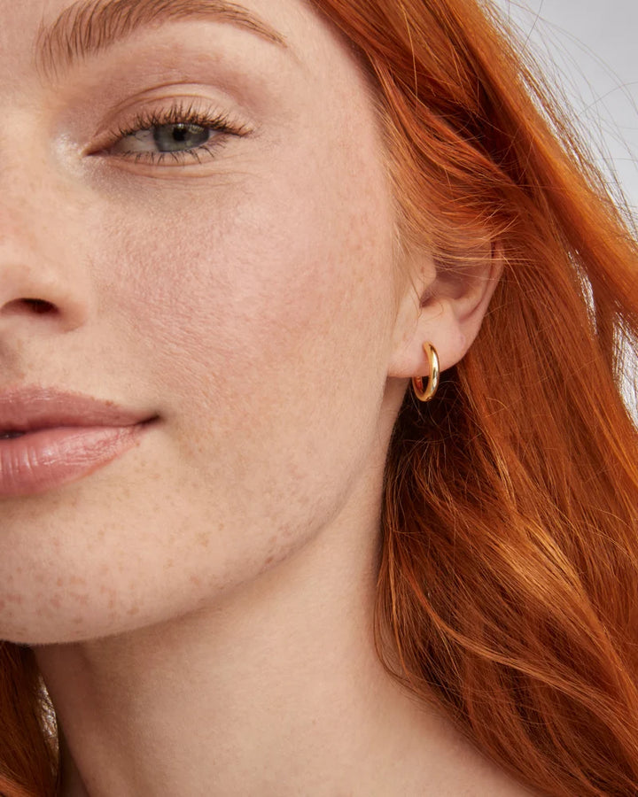 Kendra Scott | Hallie Gold Huggie Earrings in White Opalescent Resin