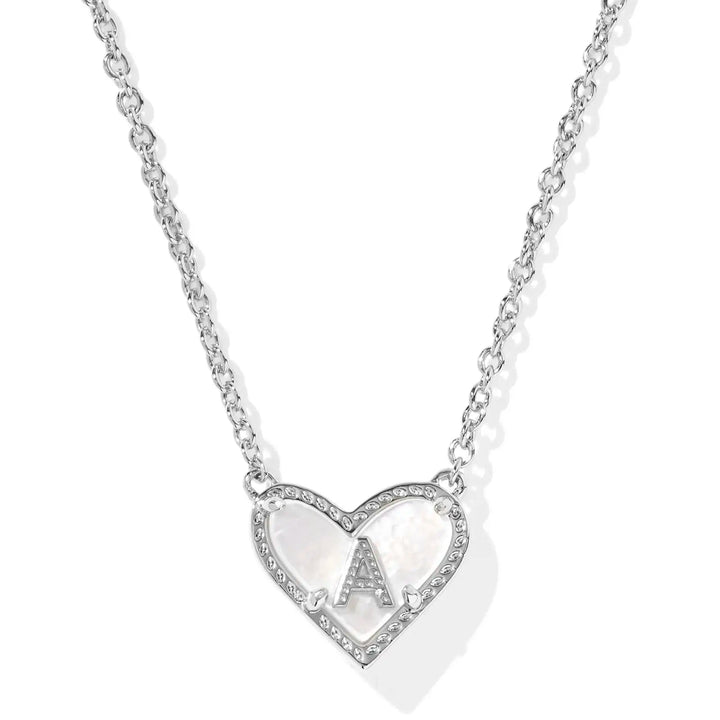 Heart-shaped initial pendant necklace on a white background