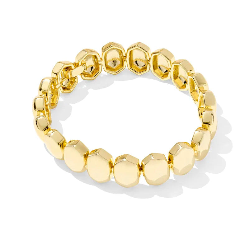 Gold beaded bracelet on a white background