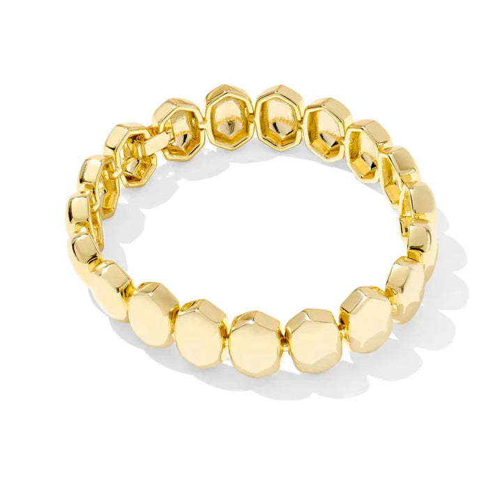 Gold beaded bracelet on a white background