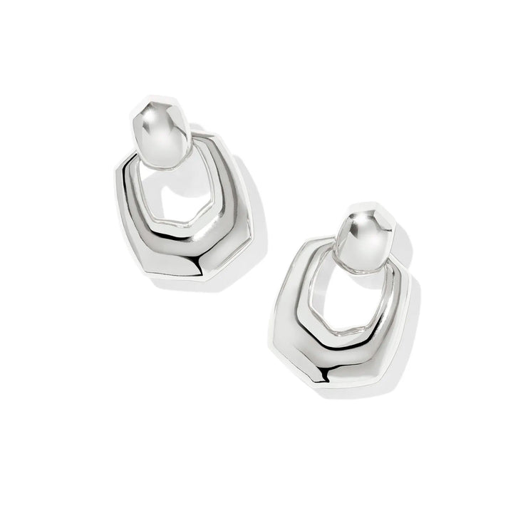 Pair of silver hoop earrings on a white background