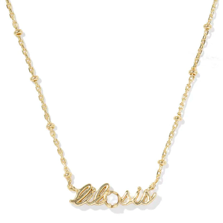 Gold 'lil sis' necklace on a white background