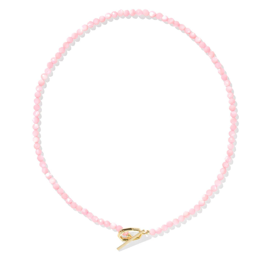 A solid white background with a Pink Chalcedony beaded necklace and gold hinge link.