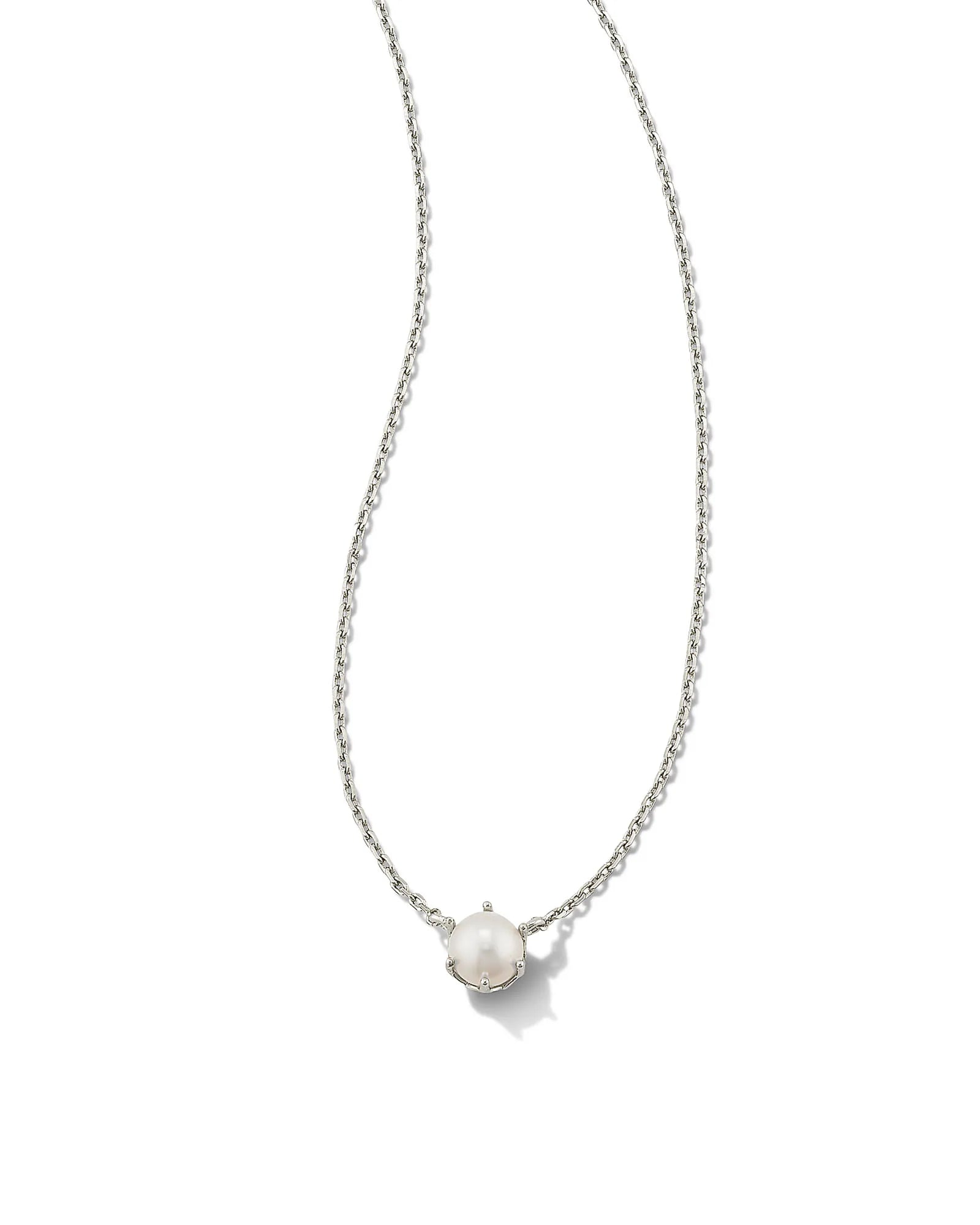 This white pearl pendant necklace by Kendra Scott is placed on a white background.