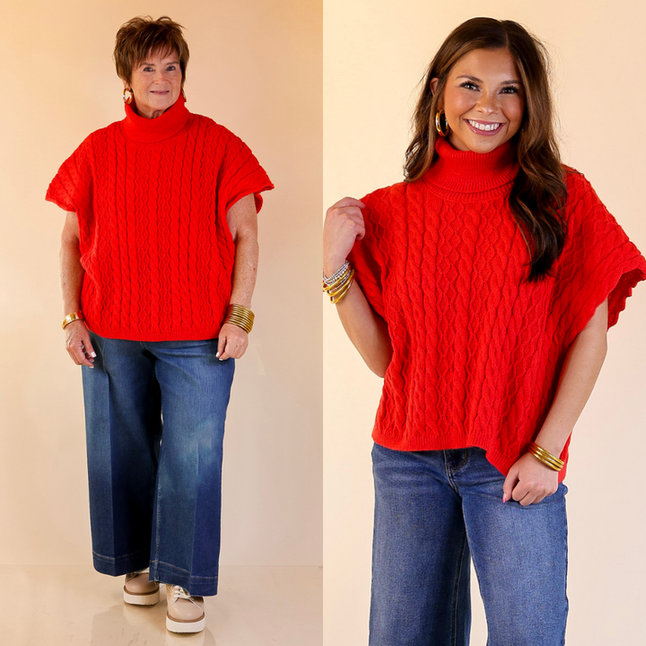 Models are wearing red turtle neck sweater and blue jeans against a beige background