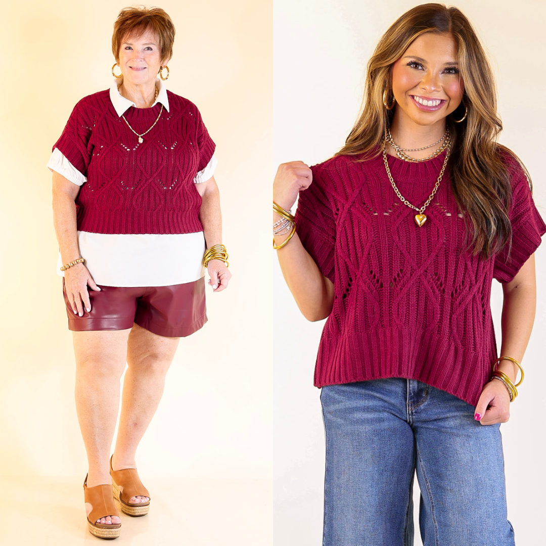 Two women wearing maroon sweater tops with different outfits on a plain background