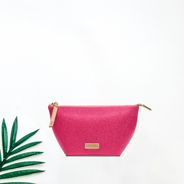 Pink pouch with a brand label on a white background