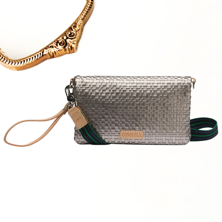 Silver woven clutch bag with strap on a white background