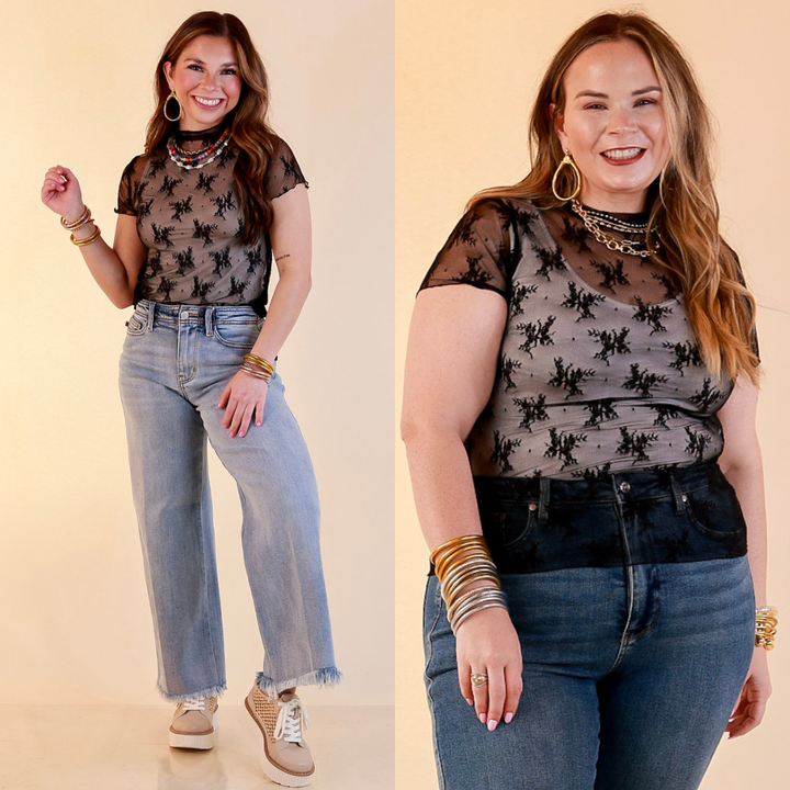 Models are wearing Sheer Mock Neck Short Sleeve Top in Black with Jeans  against a beige backdrop.