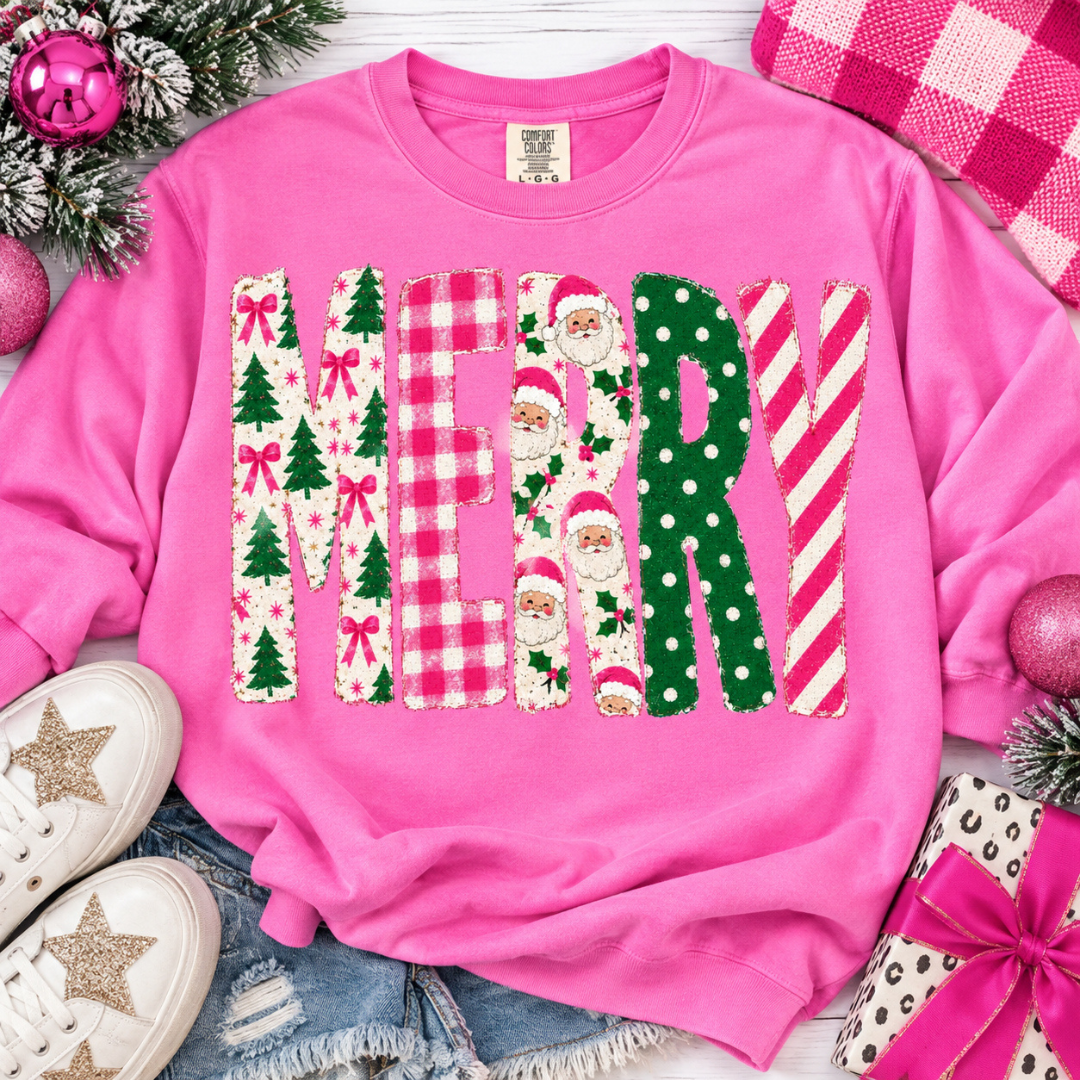 Pink Christmas graphic tee or sweatshirt featuring oversized MERRY lettering filled with Christmas trees, bows, gingham, Santas, polka dots, and stripes.