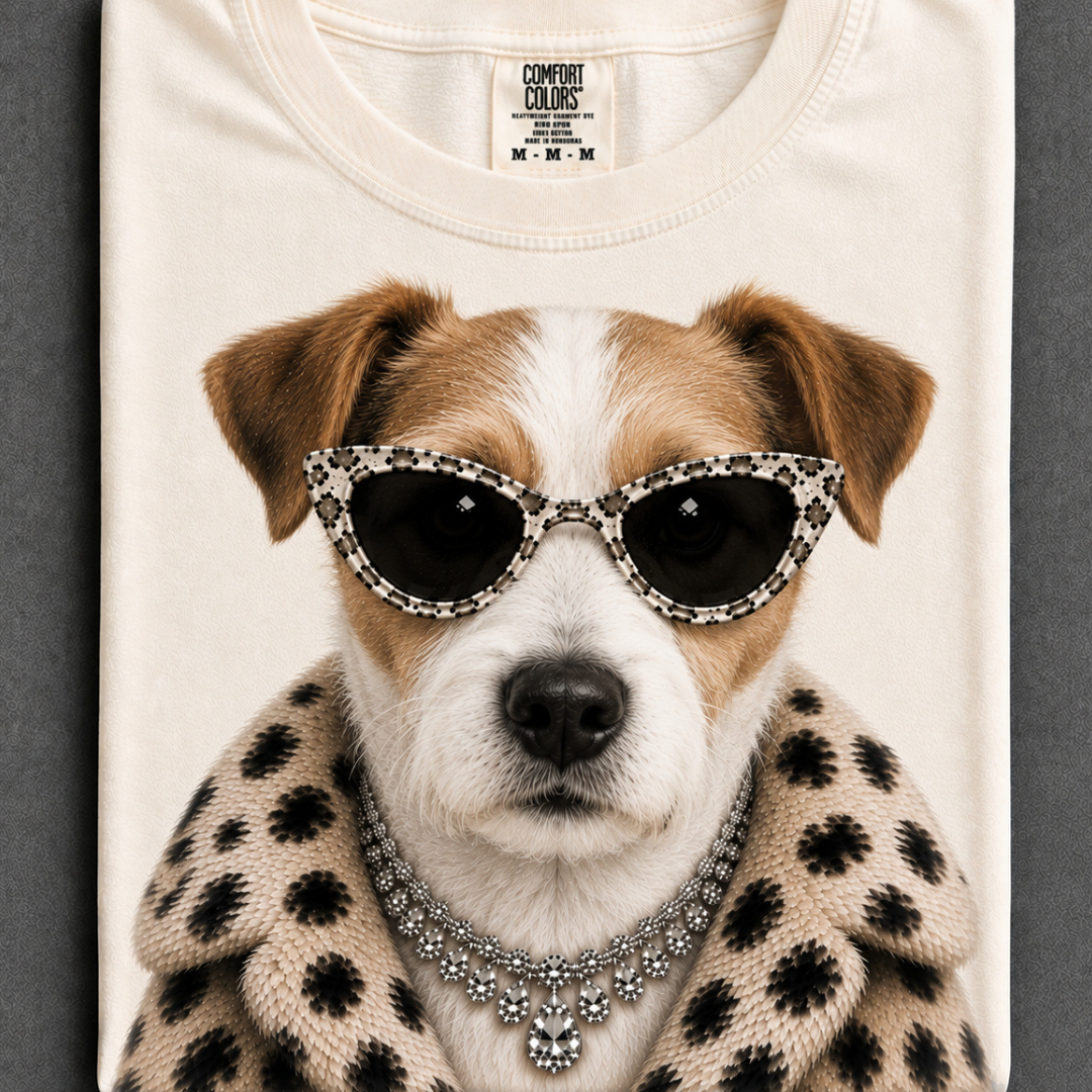 Ivory graphic tee or sweatshirt featuring a brown and white Jack Russell Terrier wearing spotted cat-eye sunglasses, statement jewelry and a spotted faux fur coat.