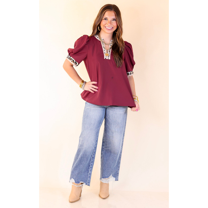 Standout Style V Neck Top with Short Balloon Sleeves and Leopard Print Trim in Maroon