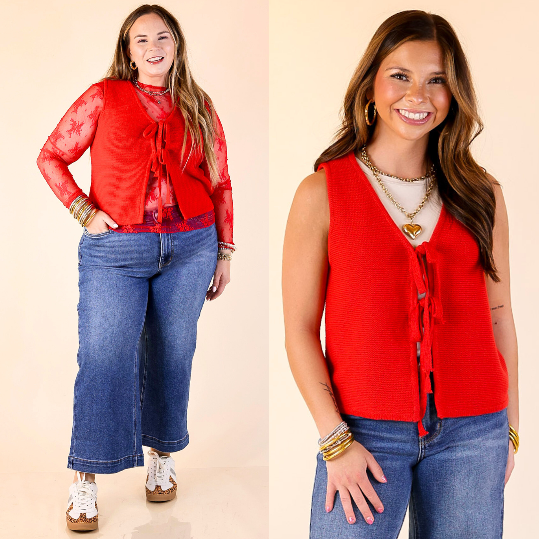 Two women wearing red bow tie vest and blue jeans on a beige background
