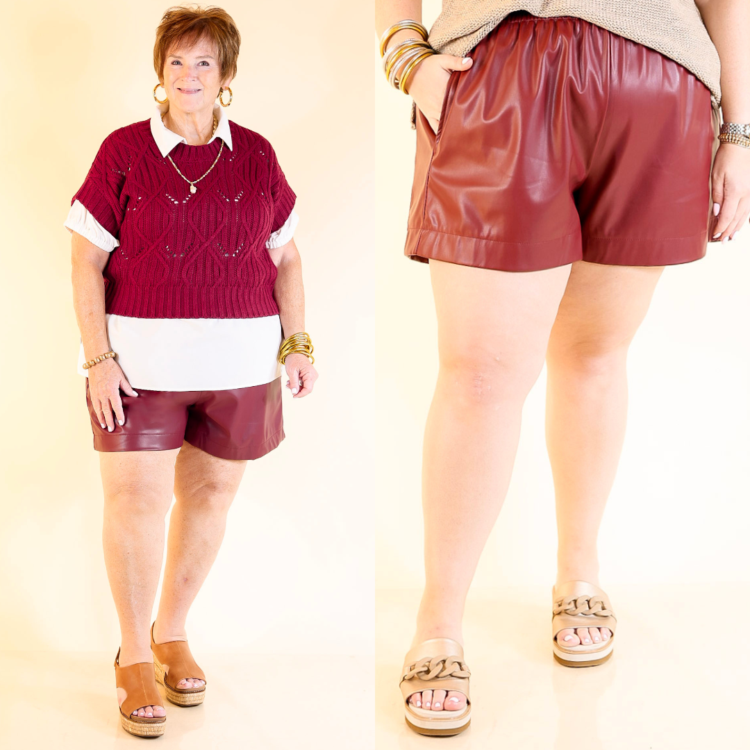 Two people wearing garnet red leather shorts on a beige background