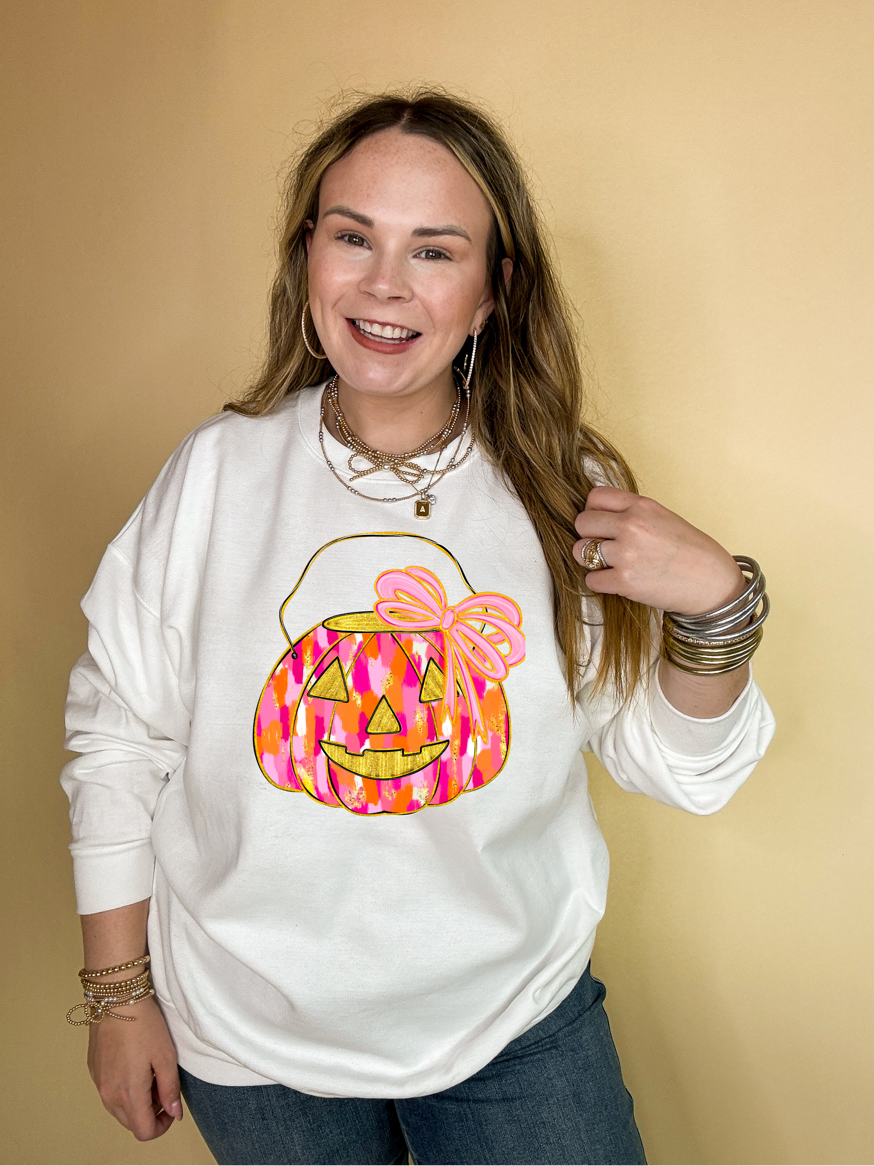 Online Exclusive | Messy Paint Trick-or-Treating Pumpkin with Pink Bow Graphic Sweatshirt in Multiple Color Options