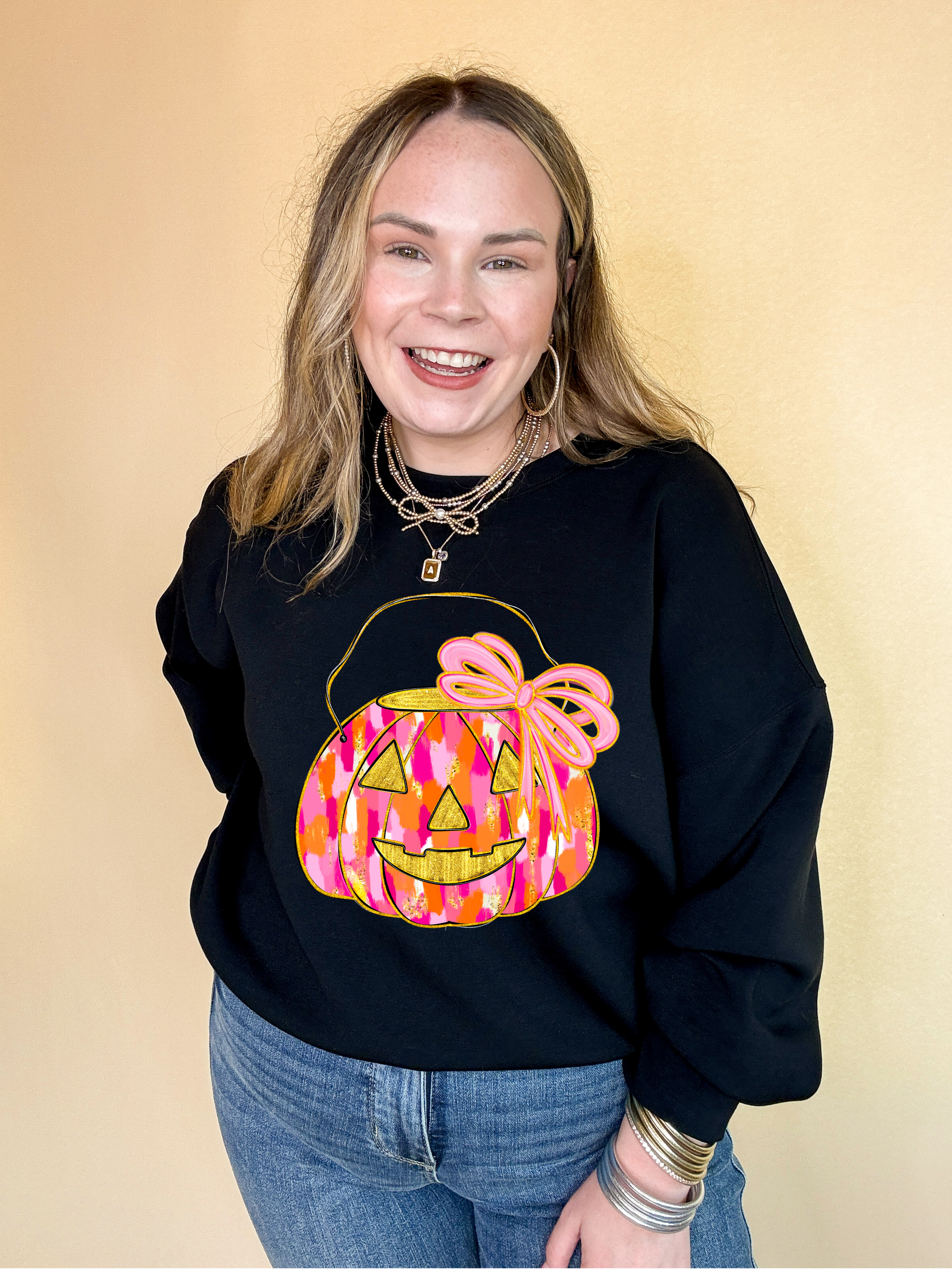 Online Exclusive | Messy Paint Trick-or-Treating Pumpkin with Pink Bow Graphic Sweatshirt in Multiple Color Options