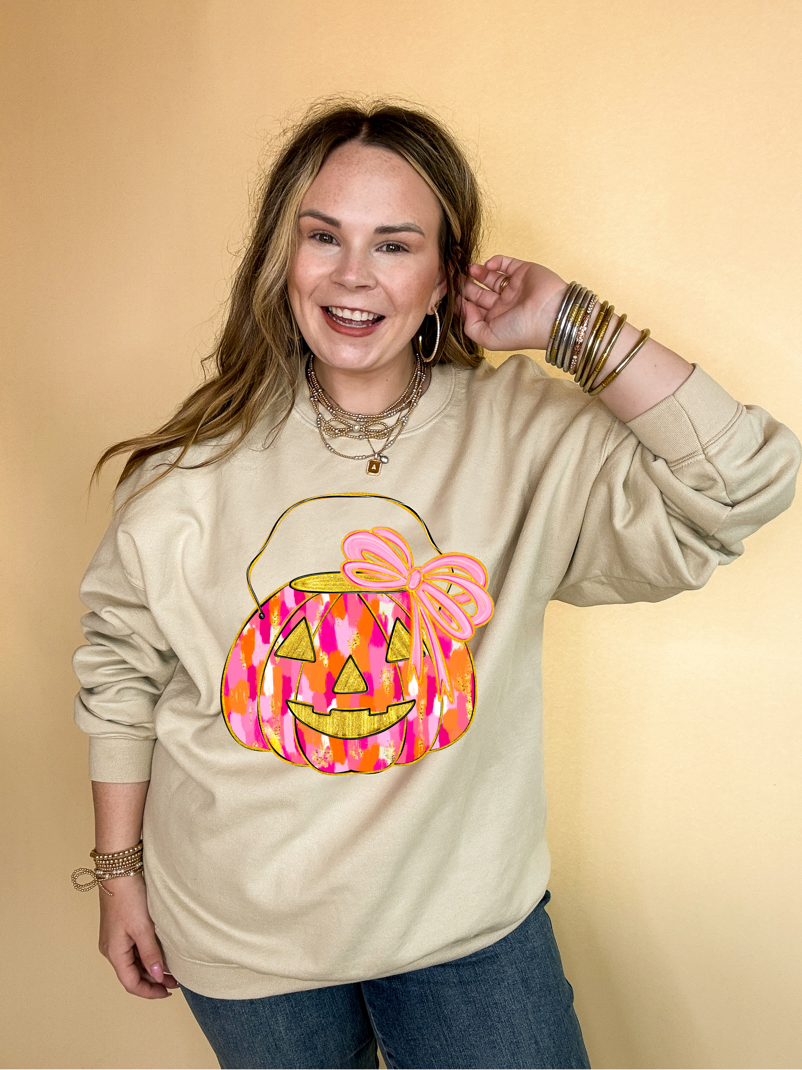 Online Exclusive | Messy Paint Trick-or-Treating Pumpkin with Pink Bow Graphic Sweatshirt in Multiple Color Options