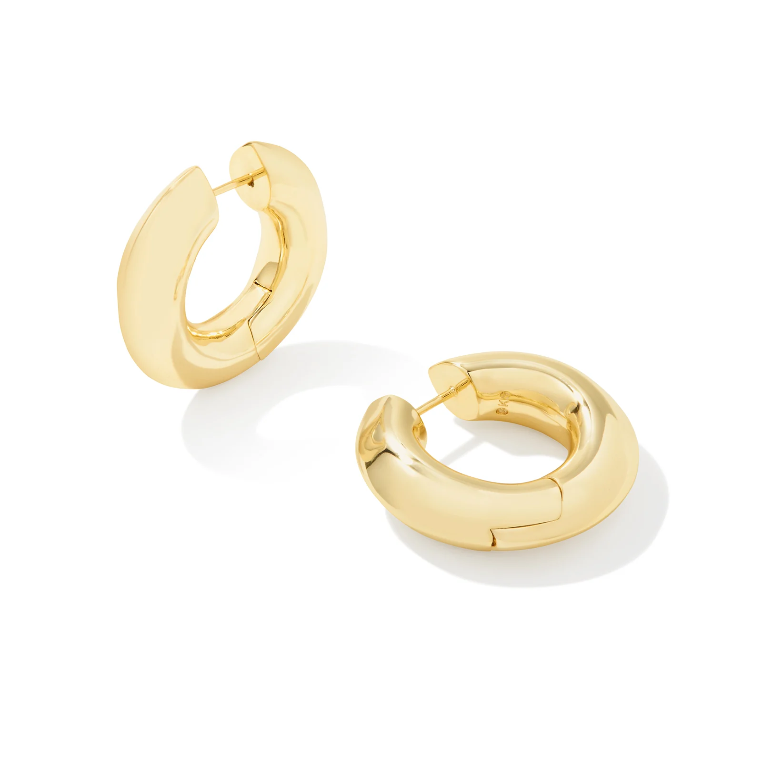 These Mikki Gold Metal Hoop Earrings in Polished Metal by Kendra Scott are pictured on a white background.