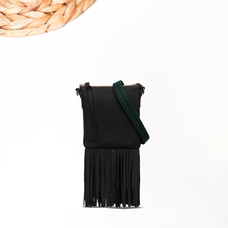 Black crossbody bag with green strap on a white background