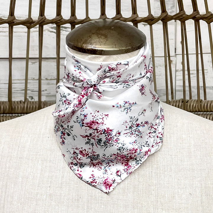 Floral patterned bandana on a mannequin bust with a wicker chair background
