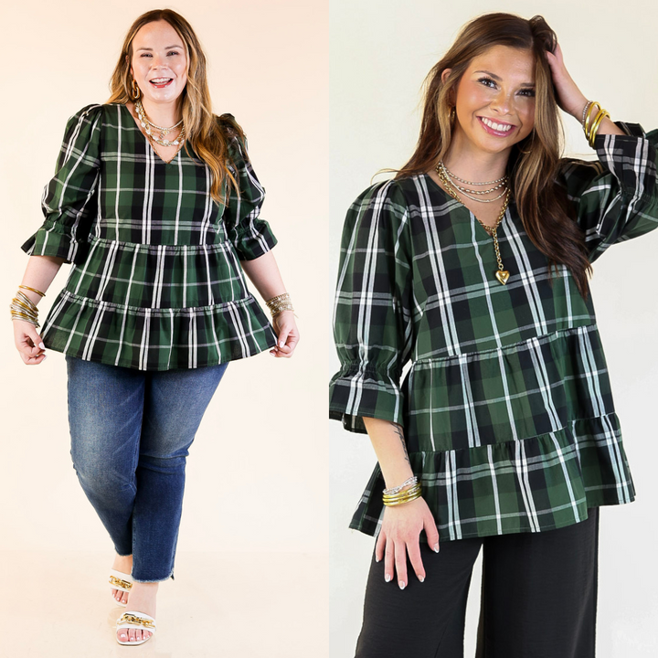 Two women wearing green plaid tops with ruffles and balloon sleeves on a plain background