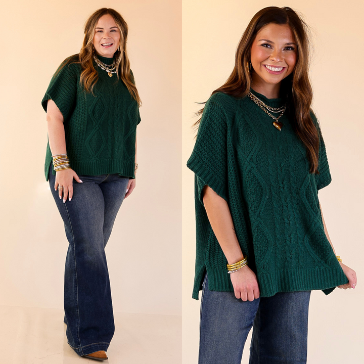 Woman wearing a green poncho sweater top on a beige background