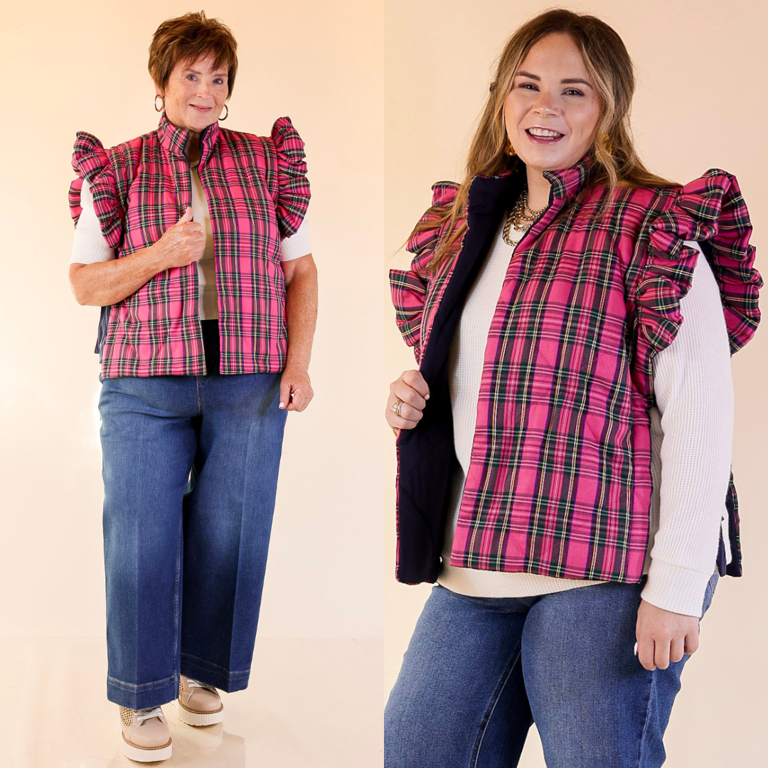Two women wearing pink plaid vests over white shirts and blue jeans on a beige background