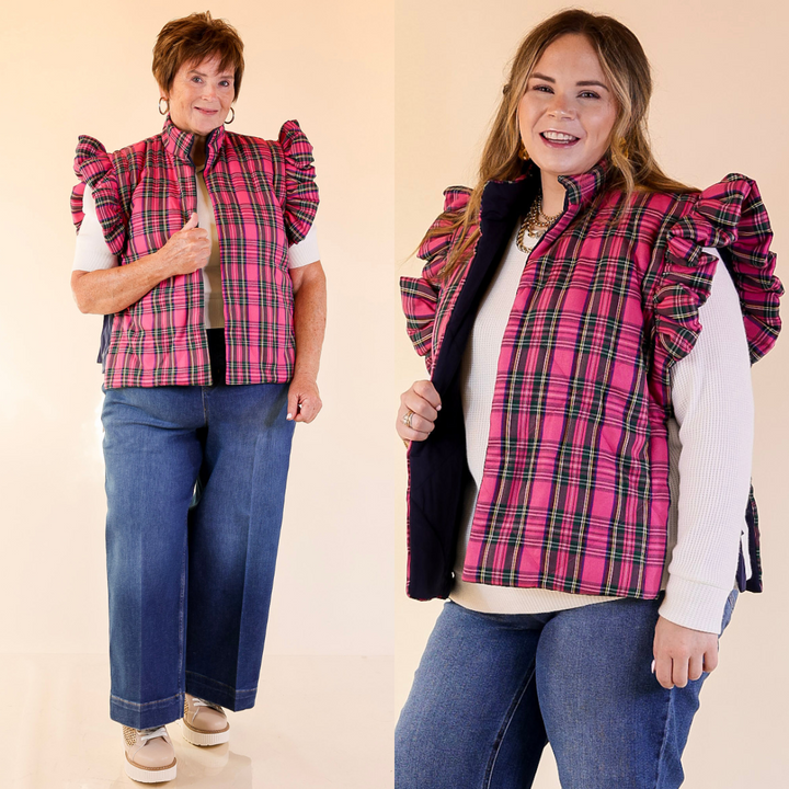 Two women wearing pink plaid vests over white shirts and blue jeans on a beige background