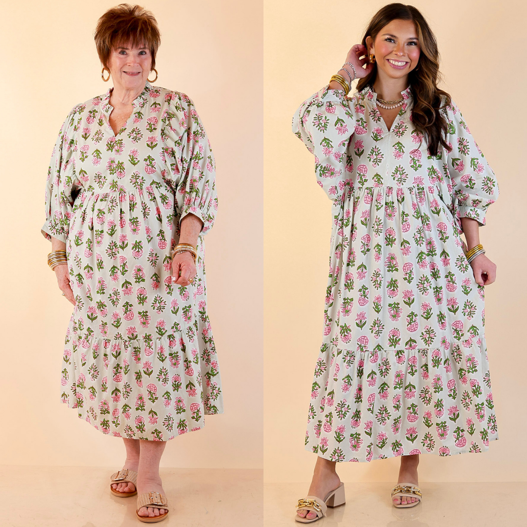 Models are wearing Cotton Poplin Floral Midi Dress with Ruffle Collar and Puff Sleeves in Sage Multi against a beige backdrop. 