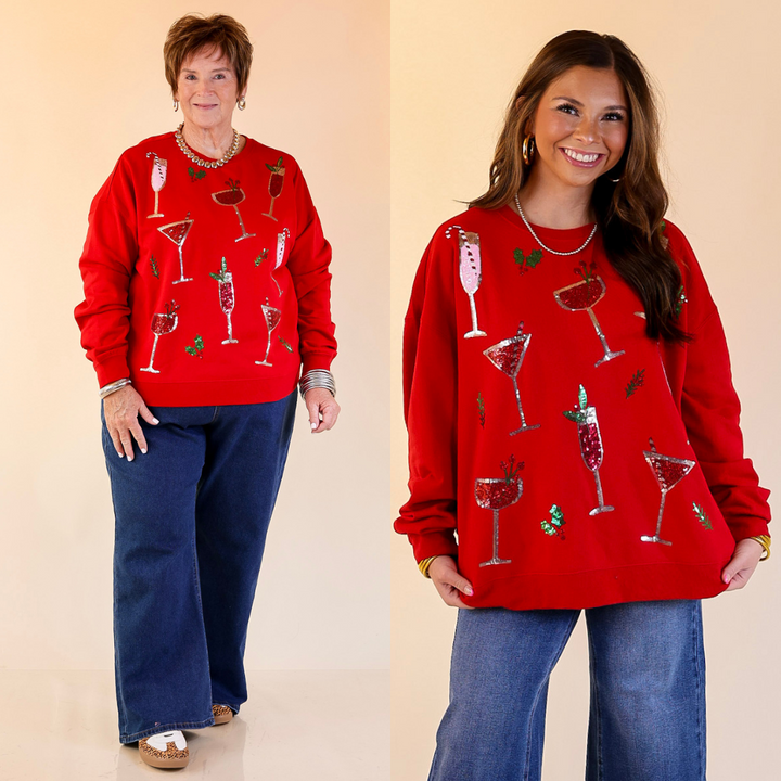 Two people wearing red sweaters with drink graphics against a beige background