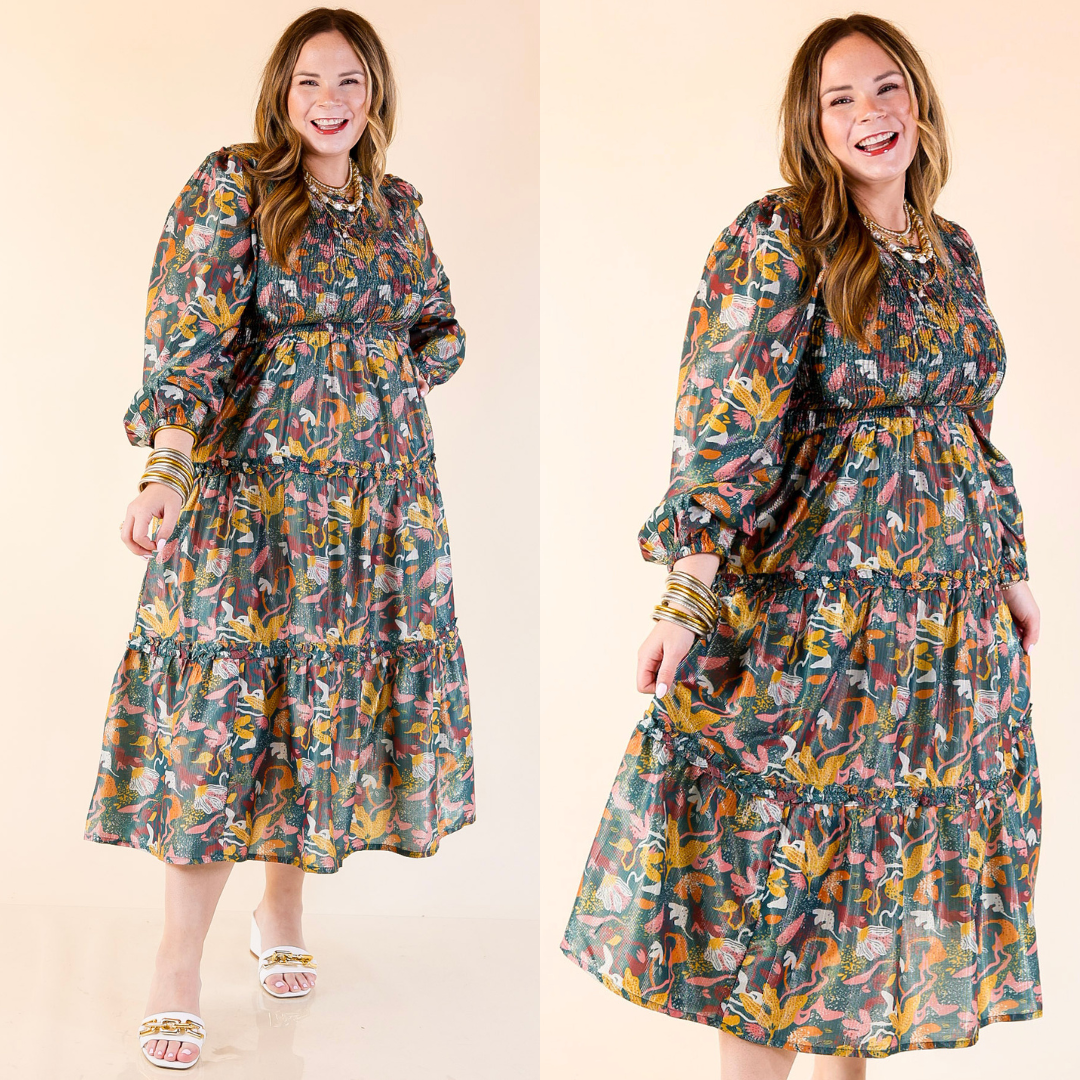 Woman wearing a Shaffer Smocked Bodice Long Sleeve Midi Dress in Blue Mix on a beige background