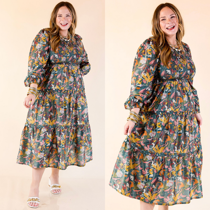 Woman wearing a Shaffer Smocked Bodice Long Sleeve Midi Dress in Blue Mix on a beige background