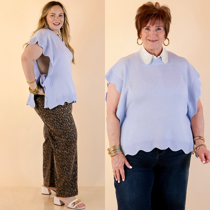 Models are wearing Mud Pie Scalloped Edge Sie Tie Knit One Sized Poncho Sweater in Blue with Jeans against a beige backdrop. 