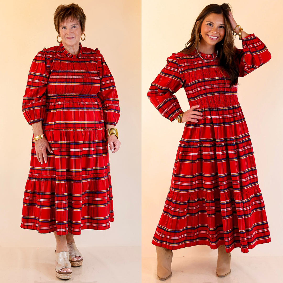 Two women wearing red plaid dresses with long sleeves against a beige background