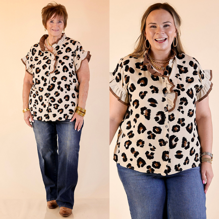 Two women wearing leopard print button up tops and jeans on a beige background