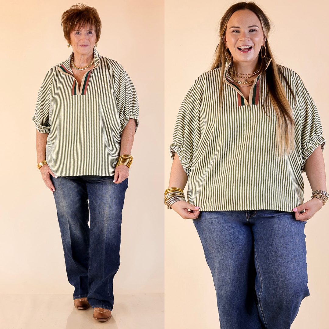 Two women striped poncho top in olive green and jeans on a beige background