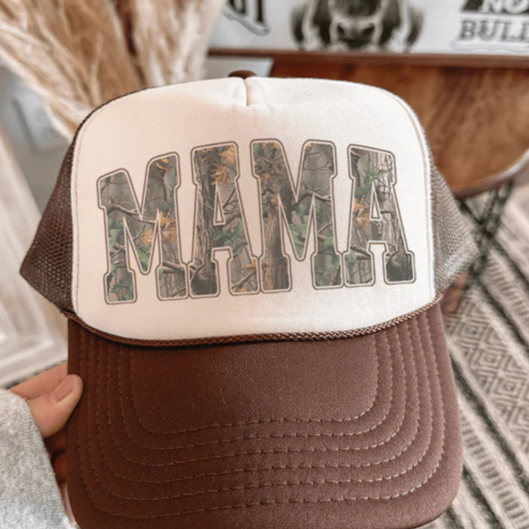 Brown and tan trucker hat featuring a bold MAMA graphic with camouflage print lettering.