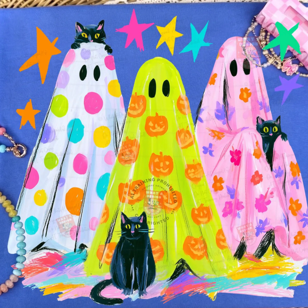 Royal blue Halloween graphic tee featuring three colorful patterned ghosts with black cats, bright stars, and whimsical spooky season artwork.