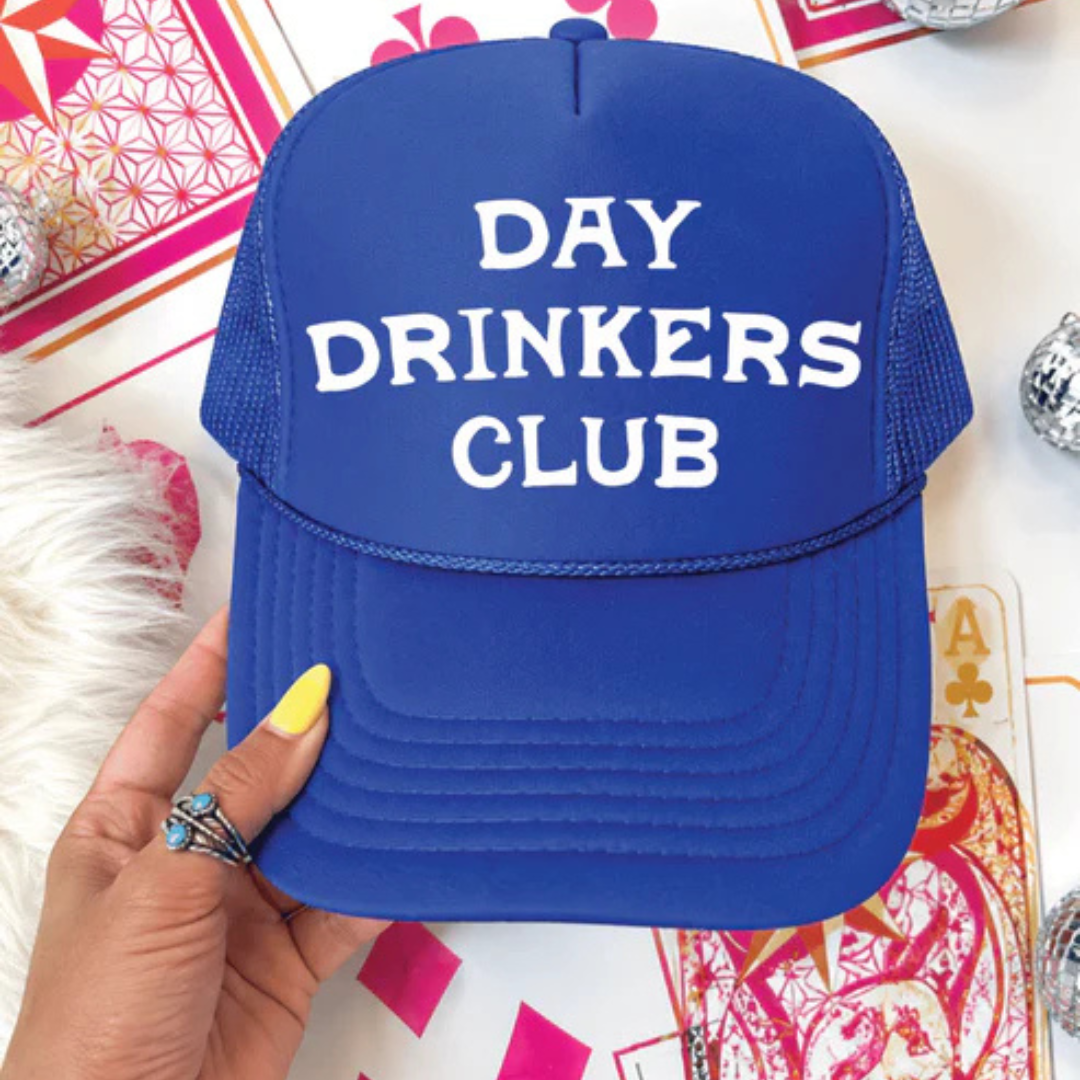 Foam trucker hat featuring "Day Drinkers Club" in bold retro white lettering on the front panel.