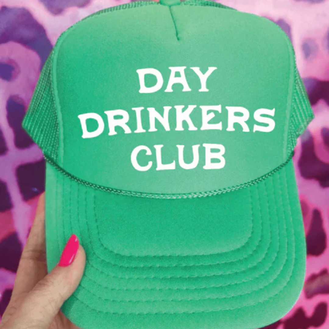 Foam trucker hat featuring "Day Drinkers Club" in bold retro white lettering on the front panel.