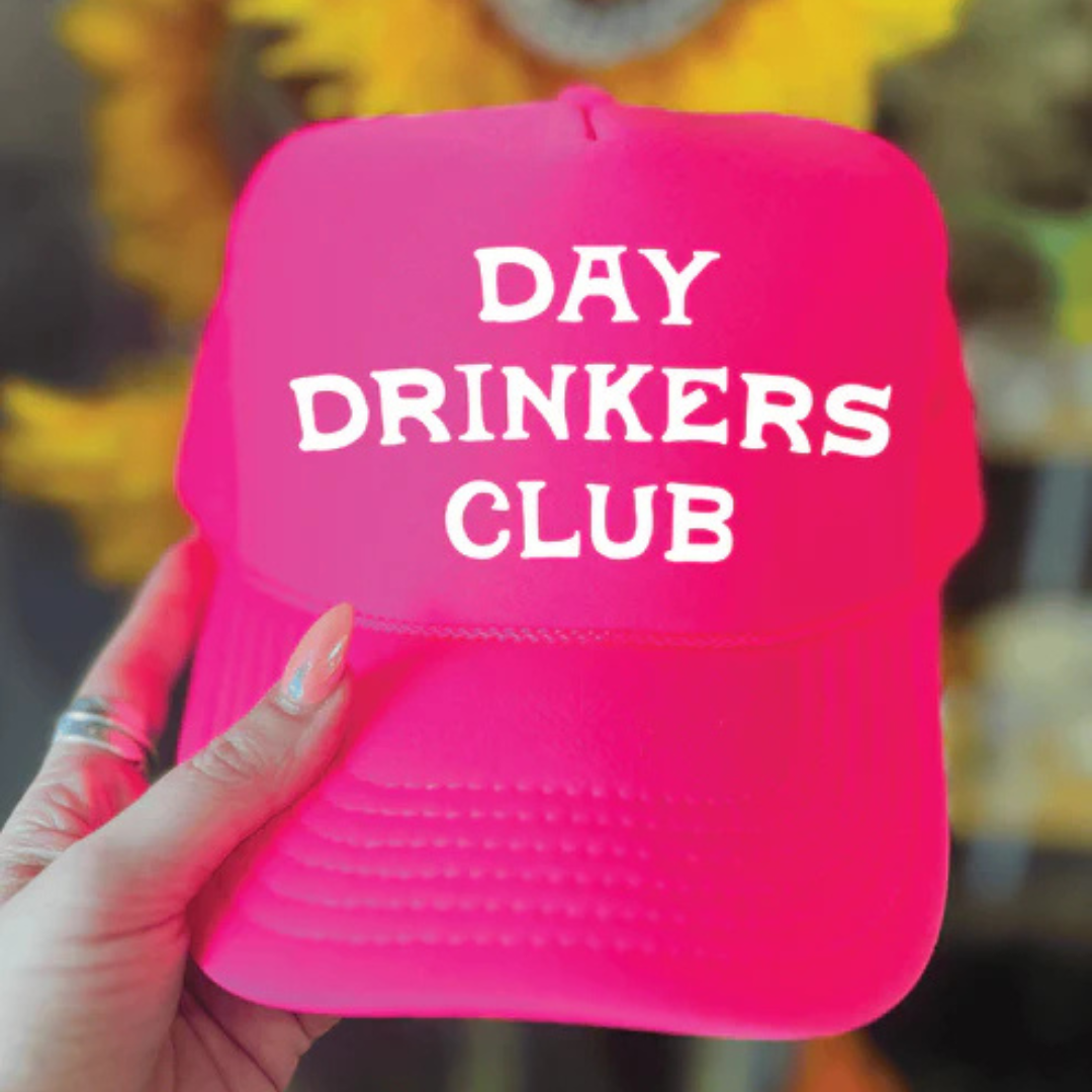 Foam trucker hat featuring "Day Drinkers Club" in bold retro white lettering on the front panel.