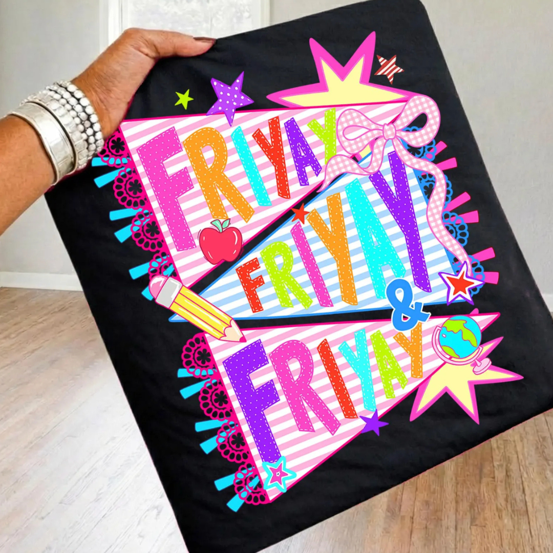 Black graphic tee featuring colorful pennant flags that read "Friyay, Friyay &amp; Friyay" with classroom icons including a pencil, apple, globe, stars, and gingham bow.