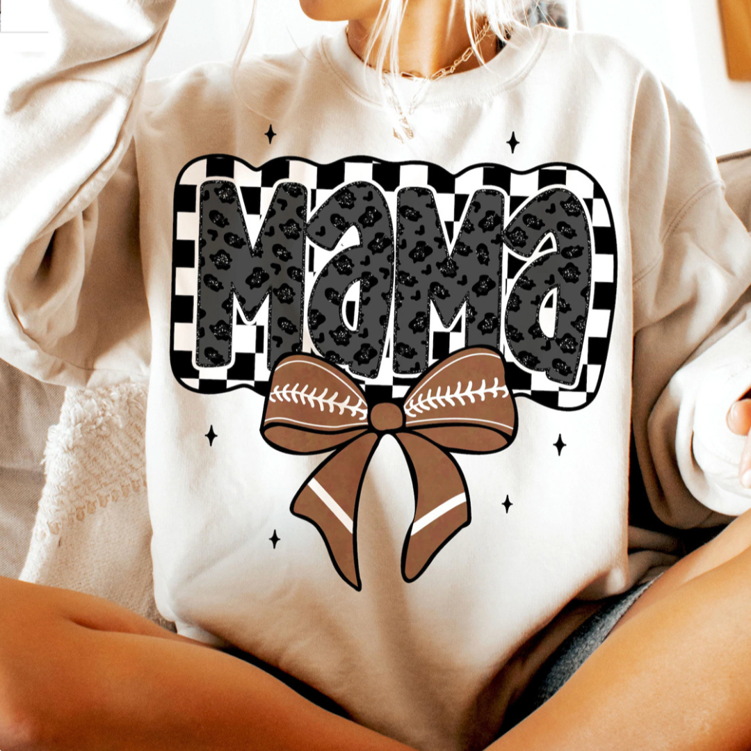 Sand sweatshirt featuring a black leopard-print "Mama" graphic on a checkerboard background with a brown football bow and small star accents.