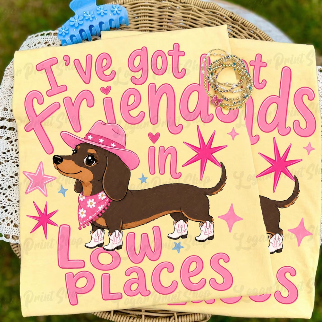 Butter yellow graphic tee featuring a dachshund in a pink cowboy hat and boots with the phrase "I&