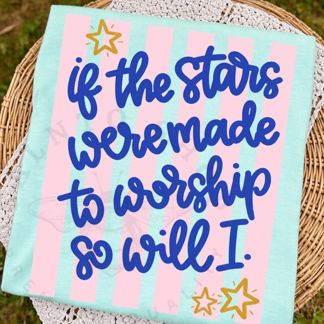 Mint green graphic tee featuring the phrase "If the Stars Were Made to Worship So Will I" in royal blue script with blush pink stripes and star accents.