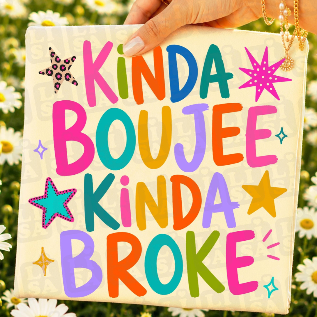 Natural cream graphic tee featuring colorful retro lettering that reads "Kinda Boujee Kinda Broke" with bright star accents.