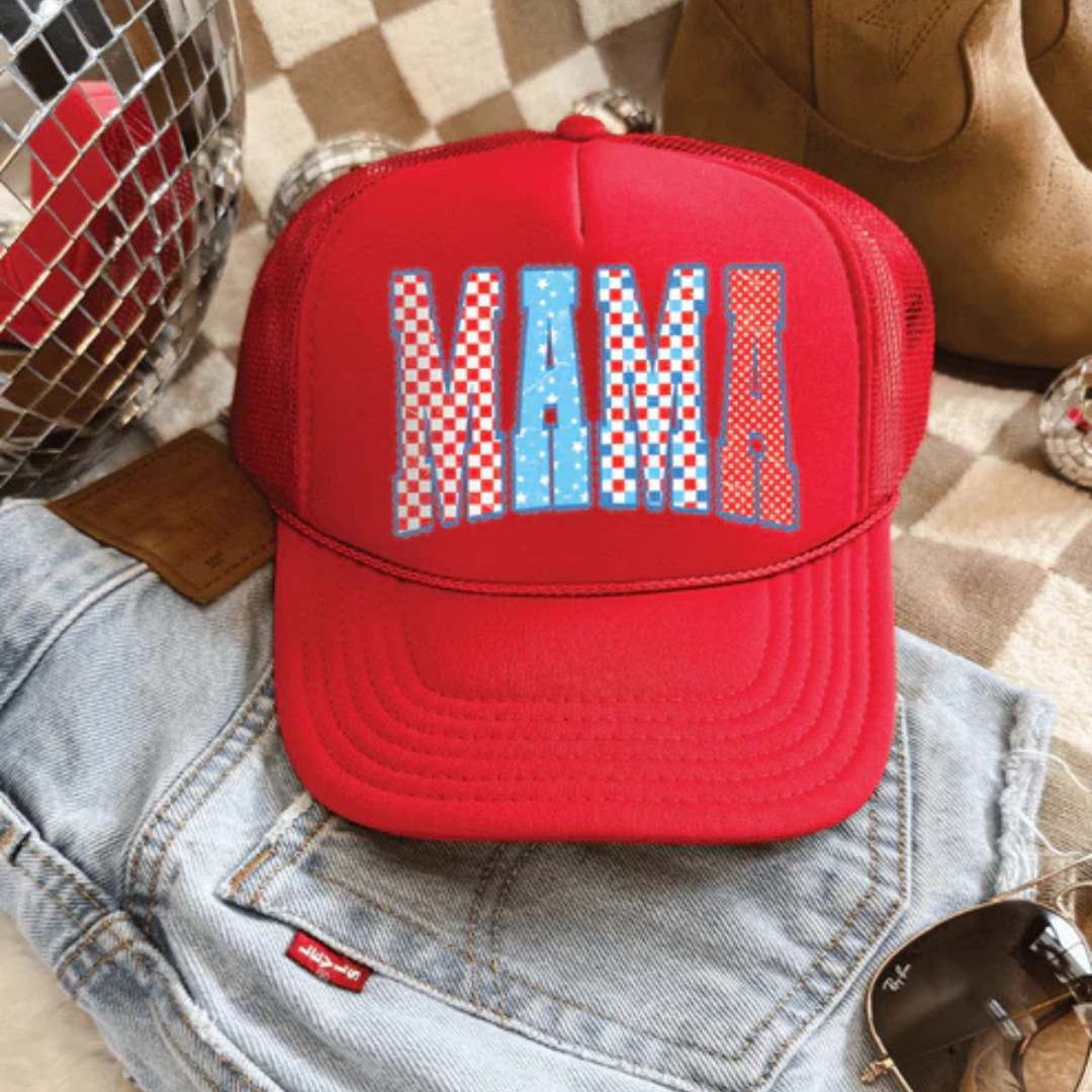Red foam trucker hat featuring patriotic MAMA lettering with red, white, and blue patterned design and adjustable snapback closure.