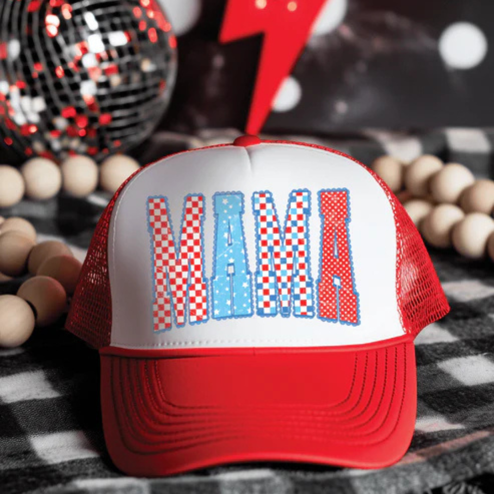 Red foam trucker hat featuring patriotic MAMA lettering with red, white, and blue patterned design and adjustable snapback closure.
