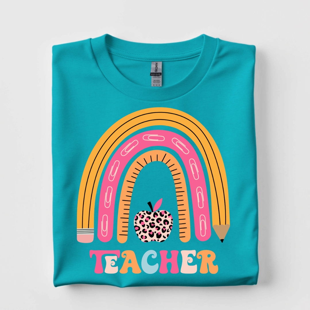 Turquoise blue graphic tee featuring a colorful pencil rainbow, leopard print apple, and retro Teacher graphic.