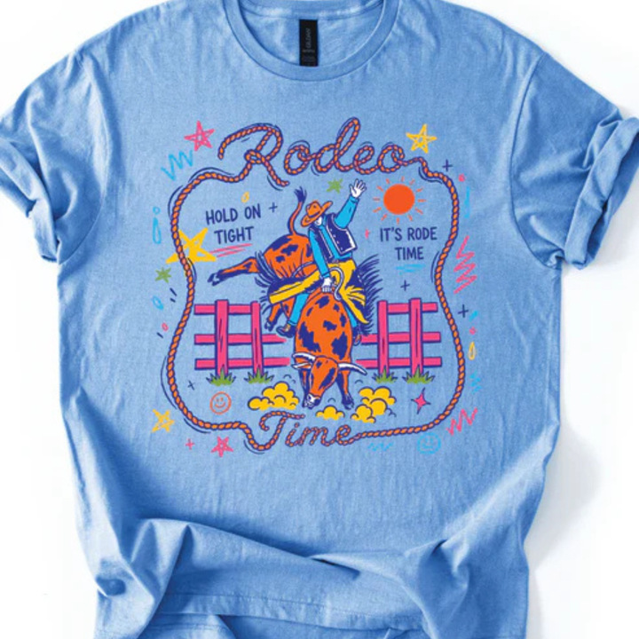Graphic t-shirt featuring a colorful rodeo bronc rider design with Rodeo Time text and western-inspired artwork in multiple color options.
